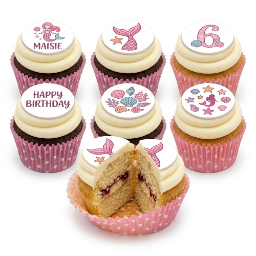 Mermaid themed birthday cupcakes with custom age and name toppers, featuring pink mermaid tails, seashells, and a "Happy Birthday" message.