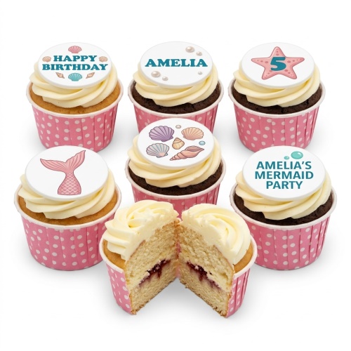 Mermaid theme birthday cupcakes with edible mermaid tails, seashells, and custom age/name toppers in pink wrappers.
