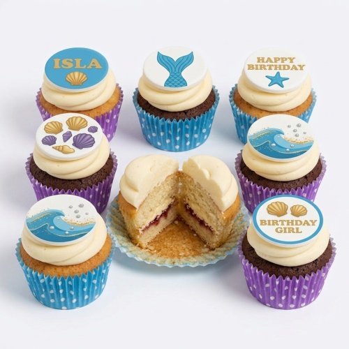 Mermaid theme birthday cupcakes with mermaid tails, seashells, and ocean wave toppers on vanilla and chocolate sponges.