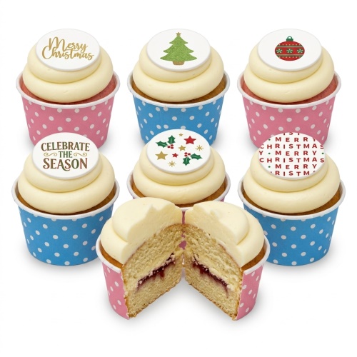 Six Christmas cupcakes with white frosting and various festive edible toppers, including a Christmas tree, bauble, holly, and 'Merry Christmas' text.