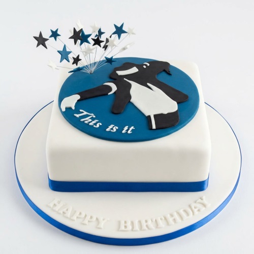 White square birthday cake with Michael Jackson silhouette and star topper.