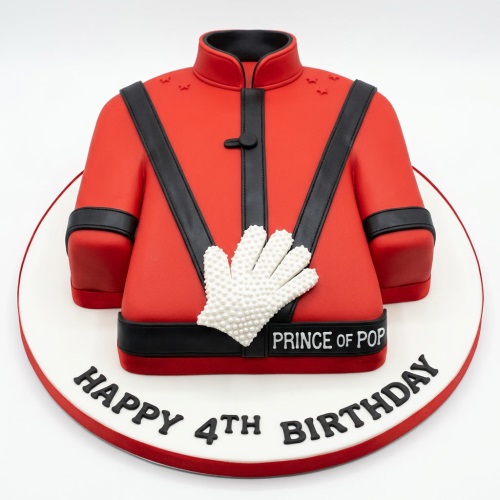 Michael Jackson red jacket birthday cake with white sequined glove and "Prince of Pop" detail, on a white cake board.