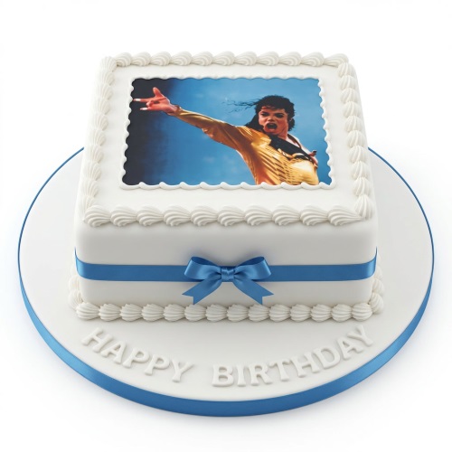Square white birthday cake with Michael Jackson photo and blue ribbon.