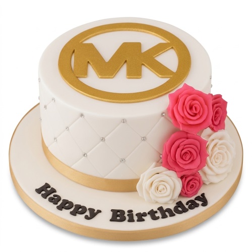 White round cake with gold MK logo, quilted pattern, silver pearls, and pink and white roses.