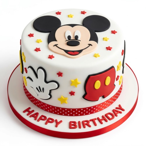 Round white Mickey Mouse birthday cake with red and yellow stars, glove, and shorts.