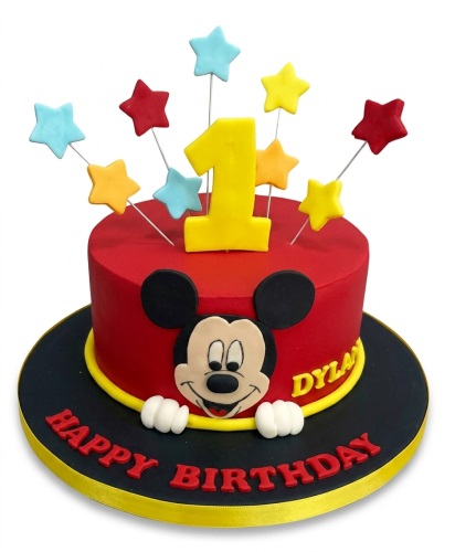 Red Mickey Mouse 1st birthday cake with yellow number one topper and colourful stars.