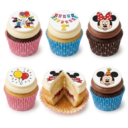 A selection of Mickey and Minnie Mouse themed birthday cupcakes with balloons and a 'Happy Birthday' banner.