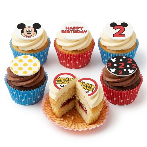 Mickey Mouse themed cupcakes with white and chocolate frosting, featuring Mickey's face, Happy Birthday, and custom age toppers.