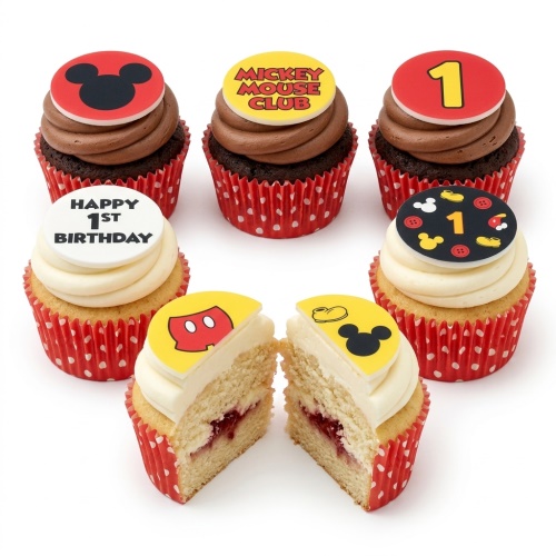 Mickey Mouse 1st birthday cupcakes with red and yellow toppers, number 1, and "Happy 1st Birthday" message.