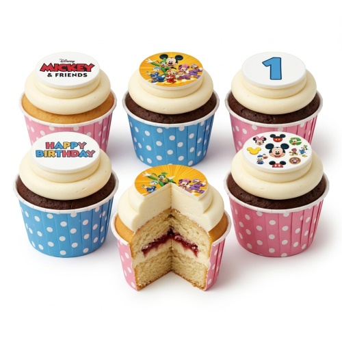 Disney Mickey & Friends cupcakes with white frosting, blue and pink polka dot wrappers, and custom age topper.