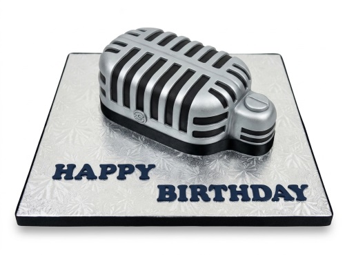3D silver and black microphone shaped birthday cake on a silver board with 'Happy Birthday' message.