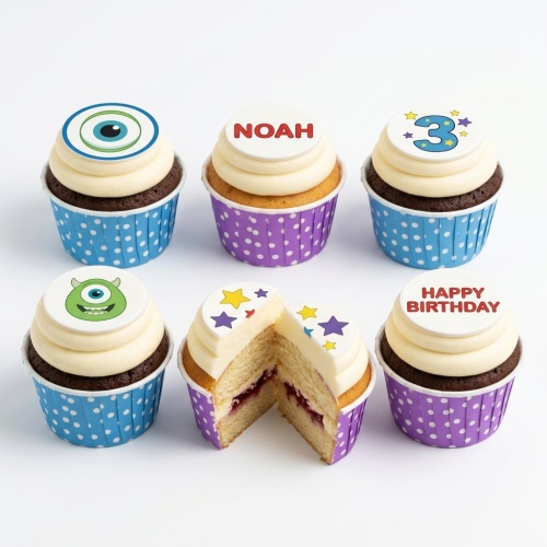 Cupcakes with monster eye, green monster face, stars, and customisable age and name toppers.