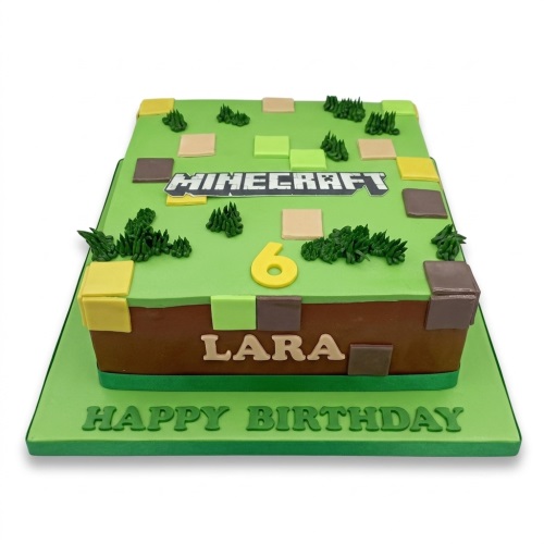 Minecraft themed birthday cake with block decorations, custom age topper, and personalised name.