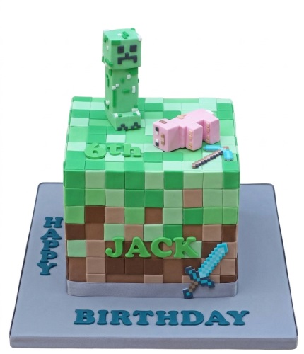 Square Minecraft themed birthday cake with a Creeper, pig, sword, and pickaxe, featuring a custom age and personalised name.