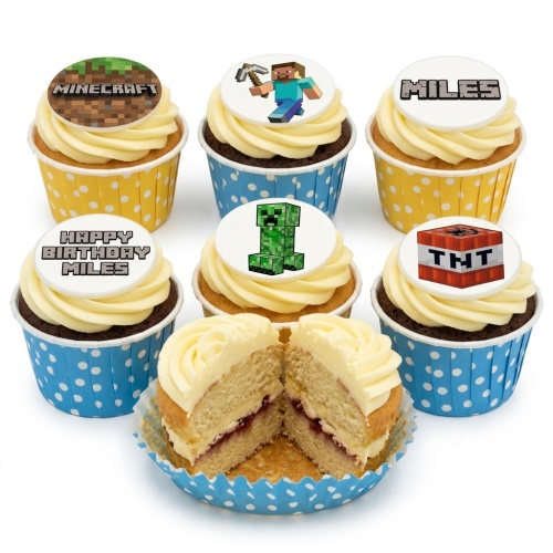 Minecraft themed cupcakes with various character and logo toppers on white icing in yellow and blue polka dot wrappers.
