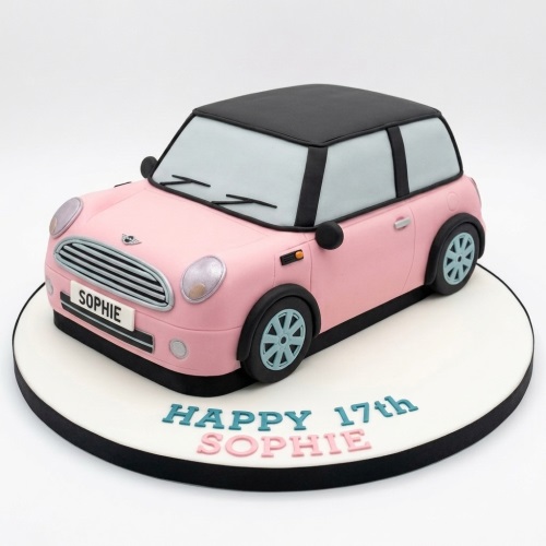 Pink Mini Cooper shaped birthday cake with black roof and custom name on number plate.