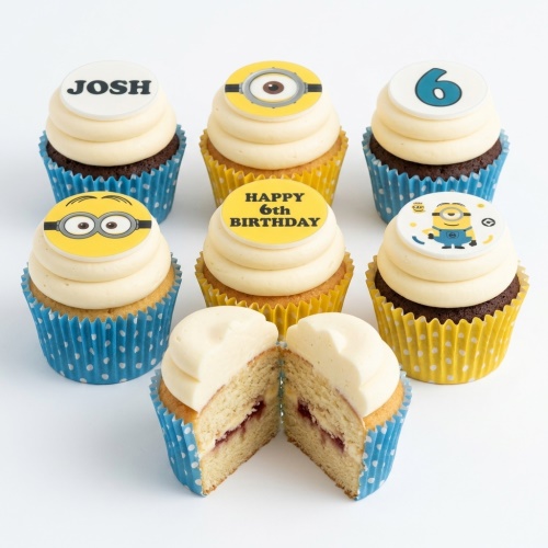Minions themed birthday cupcakes with yellow and blue cases, some with Minion character toppers, a number 6, and 'Happy 6th Birthday' message.