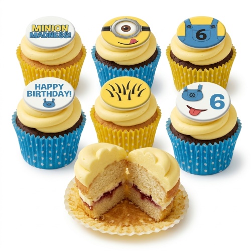 Minion themed cupcakes with yellow frosting, blue and yellow cases, and edible toppers including Minion faces, overalls, 'MINION MADNESS!', 'HAPPY BIRTHDAY!', and the number 6.