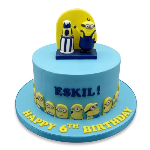 Blue Minions themed birthday cake with a 3D Minion topper, 2D Minion faces, and custom name and age.