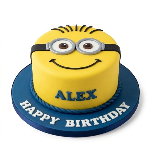 Round yellow Minion birthday cake with goggles, smile, and a personalised name on a blue board.