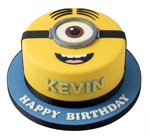 Round yellow Minions theme birthday cake with a large goggle eye and smiling mouth, on a blue cake board.