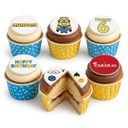 Minions themed birthday cupcakes with yellow and blue polka dot cases, vanilla and chocolate frosting, and edible Minion character and logo toppers.
