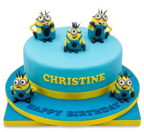 Blue and yellow two-tier Minions birthday cake with five Minion figures and a personalised name.