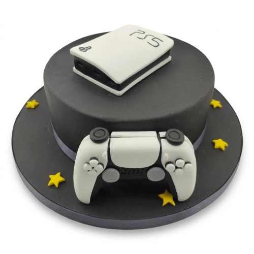 Round black cake with edible white PS5 console, controller, and yellow stars.