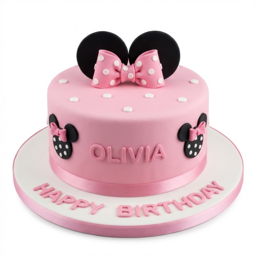 Pink Minnie Mouse birthday cake with black ears, polka dot bow, and white dots.