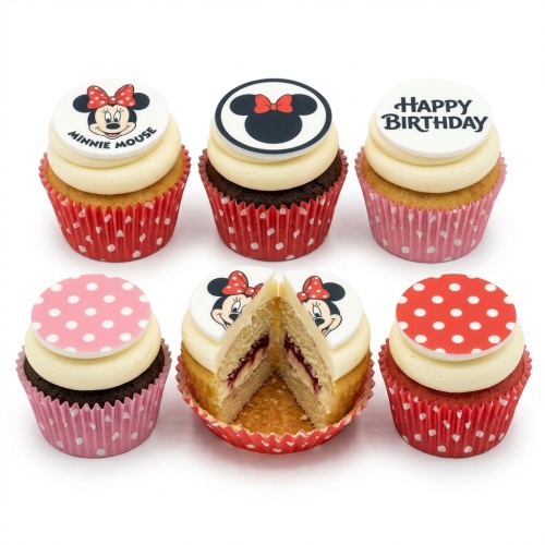 Minnie Mouse birthday cupcakes with character toppers, polka dots, and "Happy Birthday" message.
