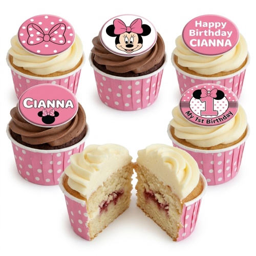 Minnie Mouse themed birthday cupcakes with pink bows, Minnie Mouse head toppers, and pink polka dot wrappers.