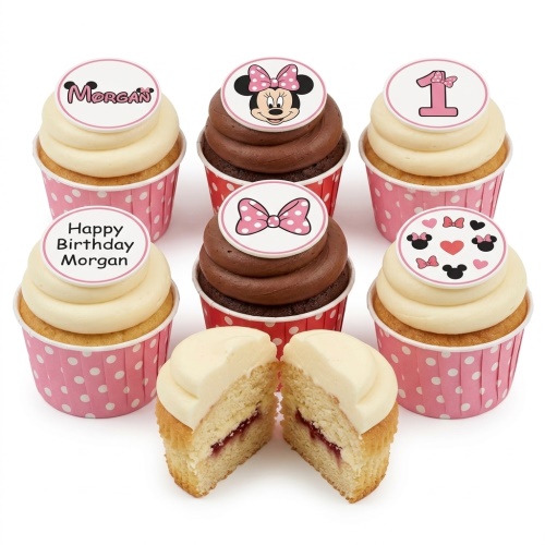Set of Minnie Mouse themed birthday cupcakes with vanilla and chocolate frosting, pink polka dot wrappers, and custom age and name toppers.