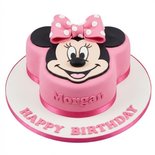 Pink Minnie Mouse shaped birthday cake with a polka dot bow and personalised name.