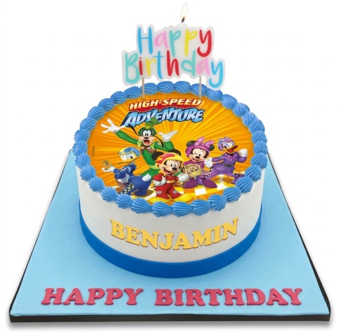 Round white birthday cake with Disney High-Speed Adventure characters and blue piping, personalised name example.