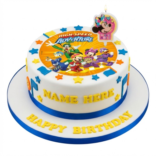 White round cake with Mickey Mouse and friends racing theme, blue ribbon, stars, and a Minnie Mouse candle topper.