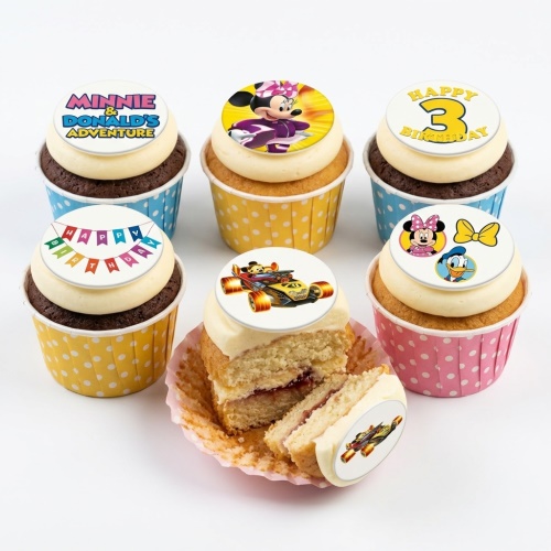 Assorted Disney character and race car birthday cupcakes with custom age and message toppers.