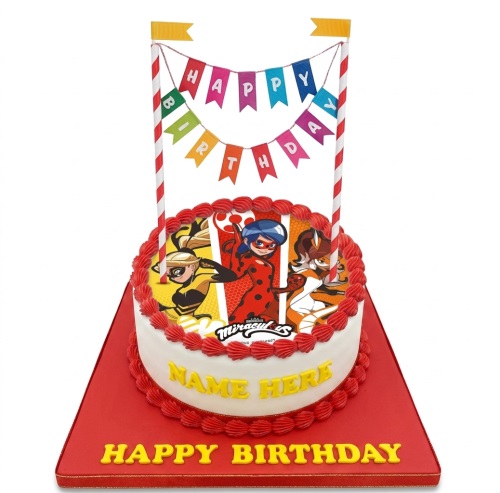 Round white cake with Miraculous Ladybug characters, red piping, and "Happy Birthday" bunting topper.