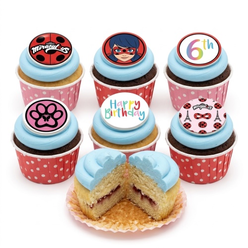 Miraculous Ladybug themed cupcakes with blue icing, red and black toppers, a custom age topper, and a "Happy Birthday" message.
