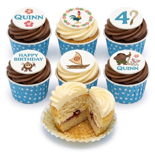 Moana themed birthday cupcakes with character toppers, sailboat, and hibiscus flowers in blue polka dot cases.