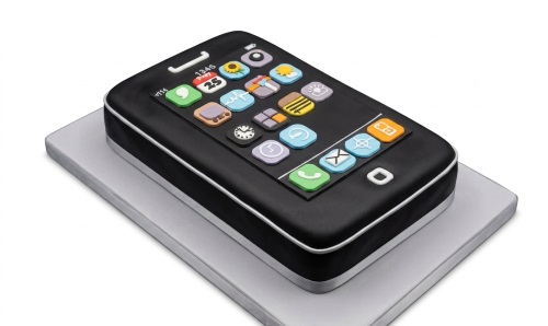 Black smartphone shaped birthday cake with colourful edible app icons on a silver board.