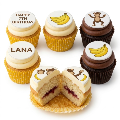 Monkey and banana themed cupcakes with vanilla and chocolate frosting, featuring custom age and name toppers.