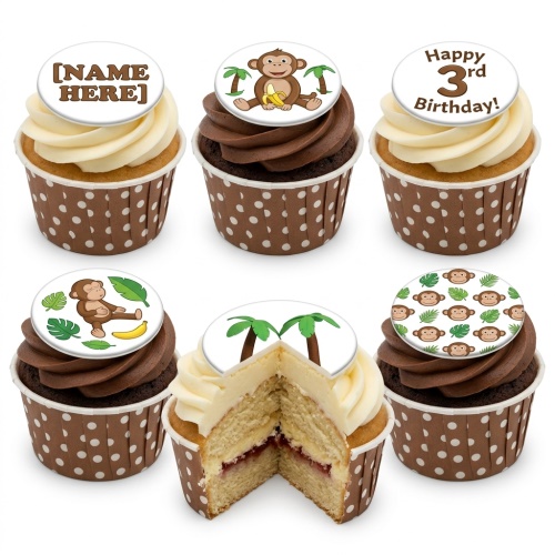 A selection of monkey themed birthday cupcakes with chocolate and vanilla frosting, brown polka dot cases, and personalised toppers.