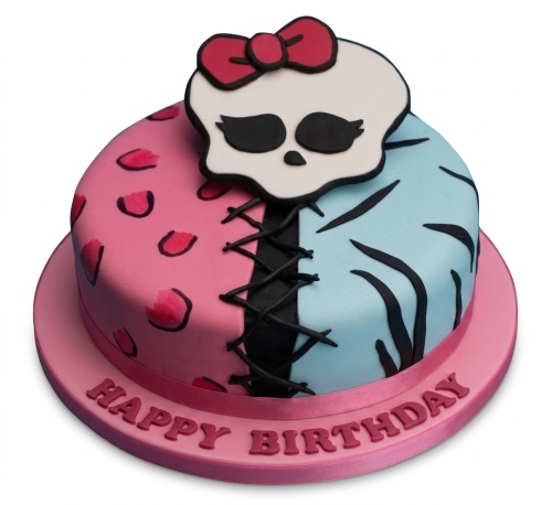 Round Monster High themed birthday cake with pink and blue halves, black lacing, and a skull topper.