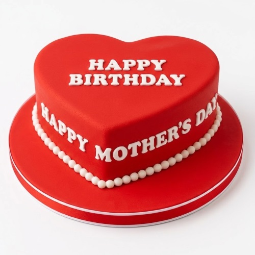 Red heart-shaped cake with 'Happy Birthday' and 'Happy Mother's Day' messages, decorated with white pearls.