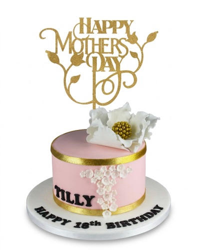 Elegant pink and gold birthday cake for her with white sugar flowers and a custom message board.