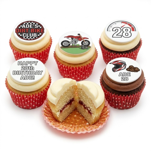 Dirt bike themed birthday cupcakes with custom age and motocross helmet toppers.