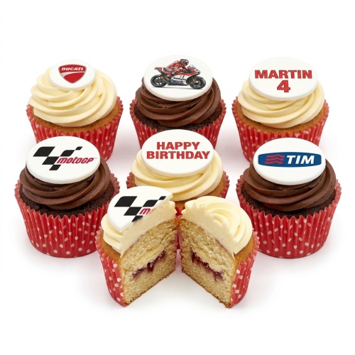 Cupcakes with MotoGP, Ducati, and motorcycle racer toppers, some with 'Happy Birthday' text.