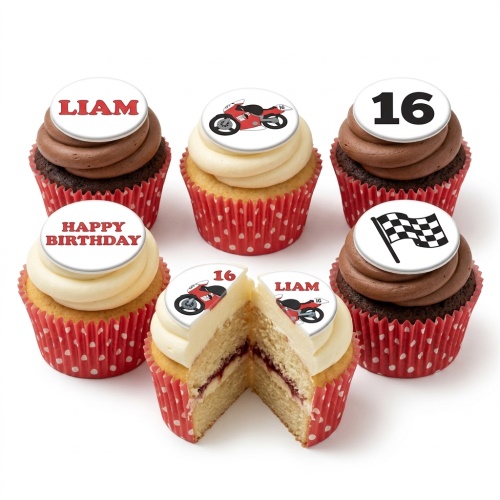 A selection of motorbike racing themed birthday cupcakes with red polka dot cases, featuring motorbike, checkered flag, and custom age toppers.