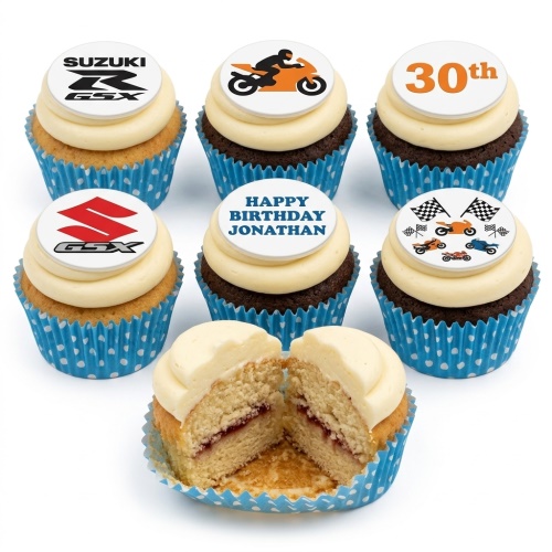 Motorbike themed cupcakes with Suzuki logos, motorcycle riders, racing flags, and custom age and name toppers.