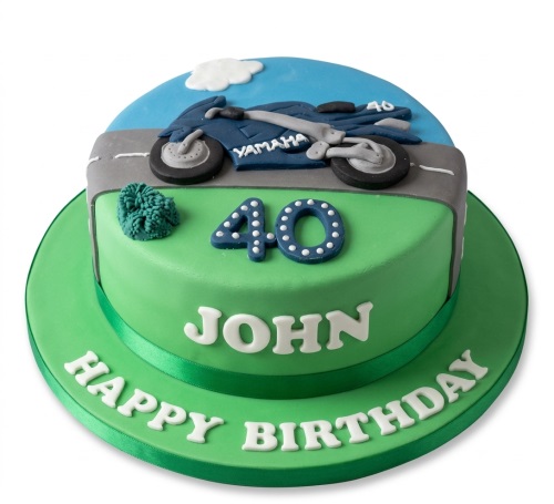 Two-tiered green and blue motorcycle birthday cake with a custom age topper and personalised name.